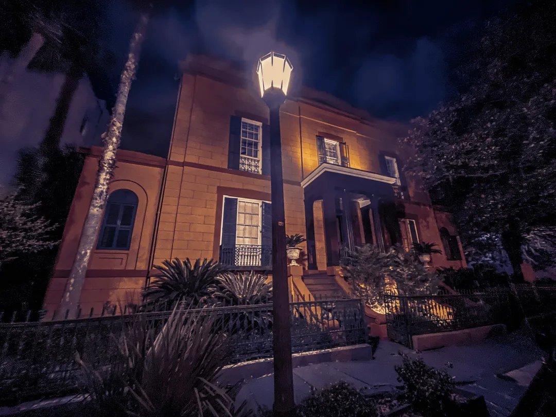 A photo of the Sorrel-Weed House at night.