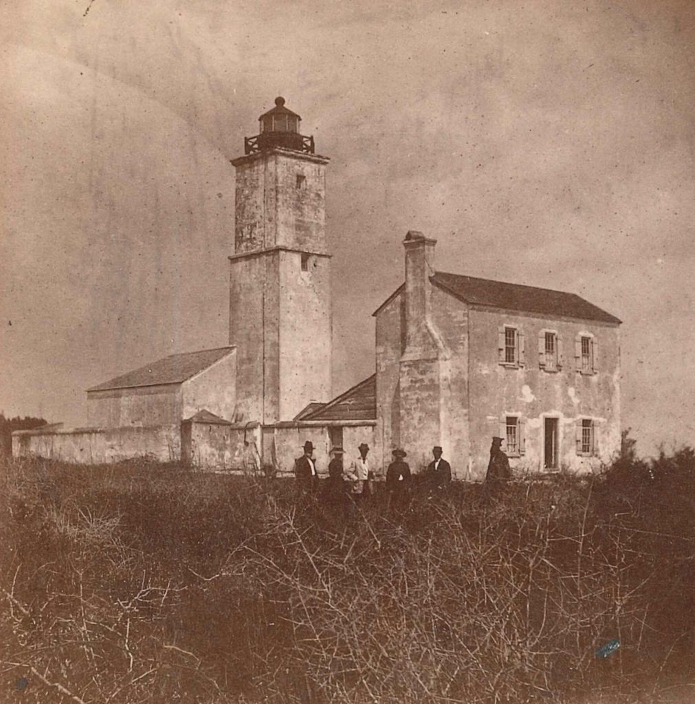 Keeper William Russell standing at far right in front of the old Spanish watchtower with a group of visitors